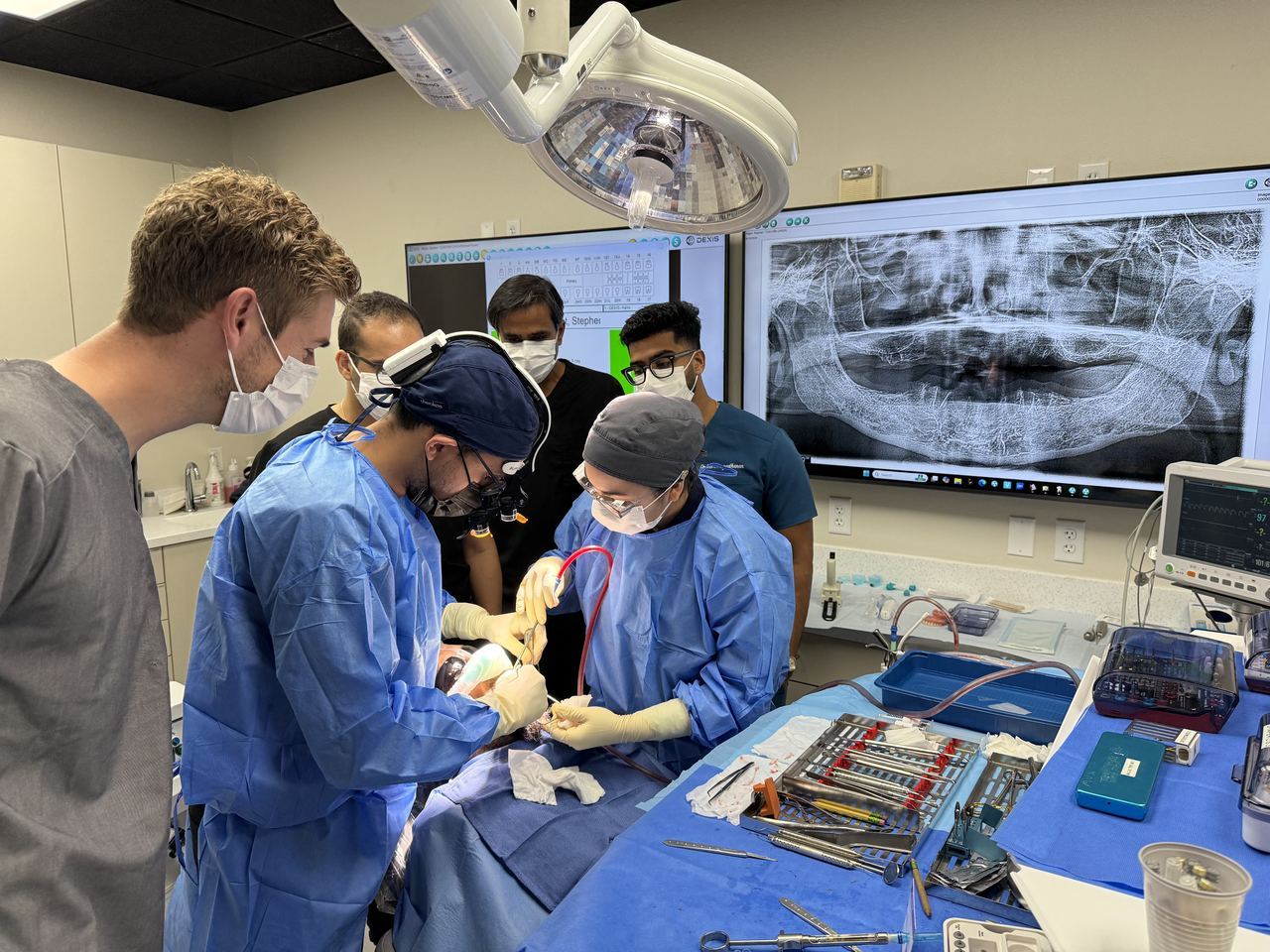 Dentists performing supervised live implant surgery at Brighter Way Dental Center