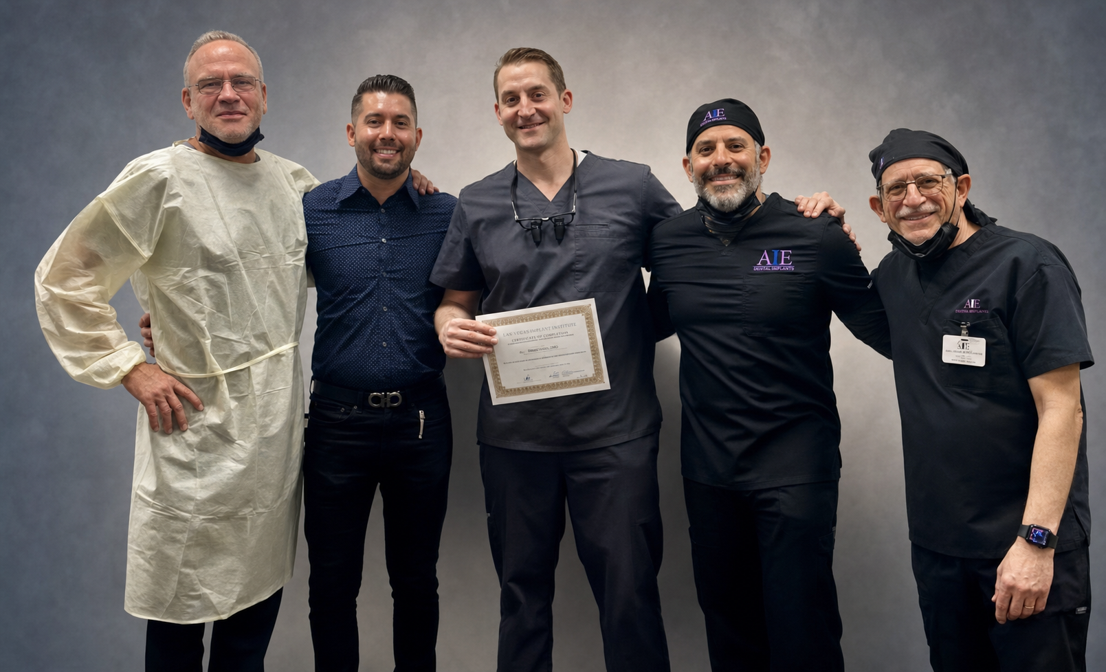 Dental professionals celebrating the completion of advanced implant education